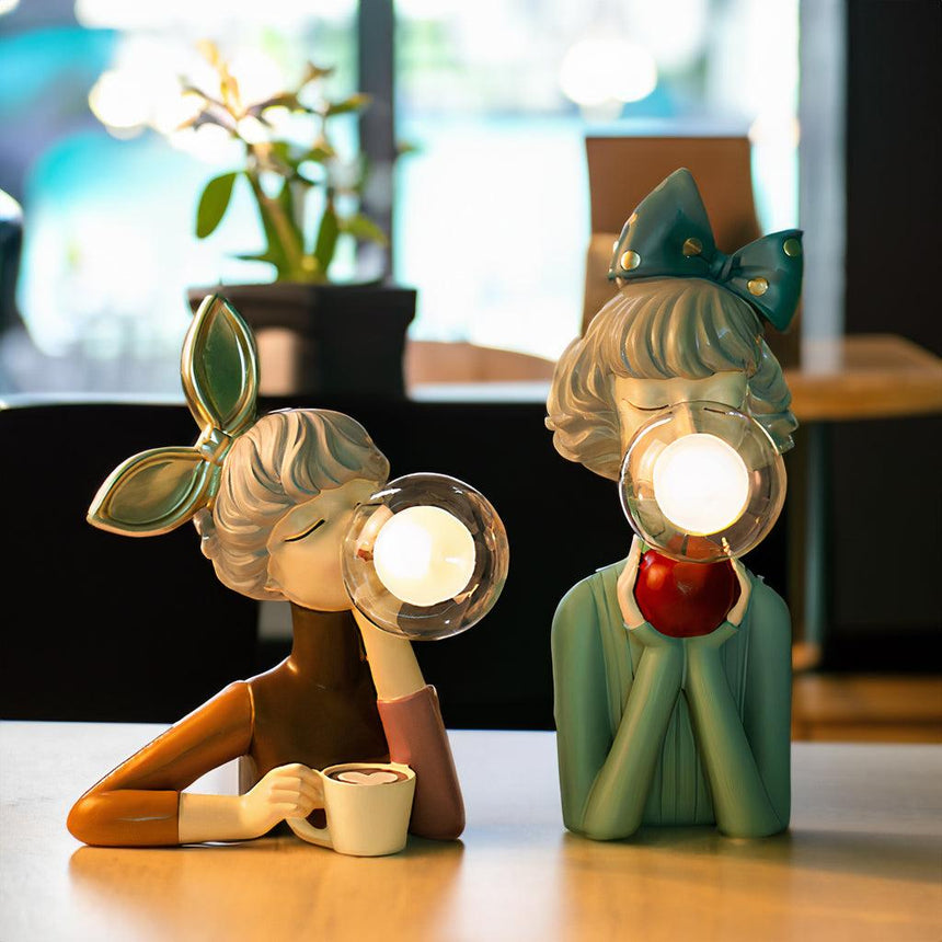 Nightlight statue glowing in dark room