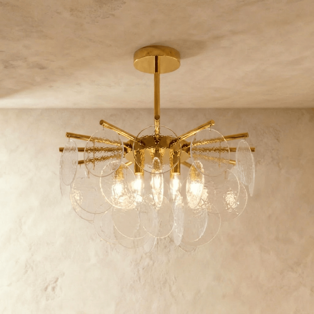 A gold hub with radiating rods carrying tiers of frosted bubbled glass discs