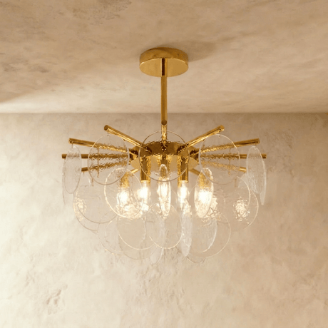 A gold hub with radiating rods carrying tiers of frosted bubbled glass discs