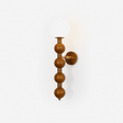 Bubble wall sconce, stacked wood beads under a white glass globe