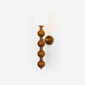 Bubble wall sconce, stacked wood beads under a white glass globe