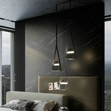 Two shades hung beside a bed in a room with a dark stone wall
