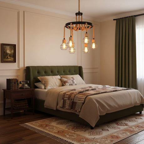 Chandelier lit in a bedroom above the foot of a made bed