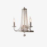 Distressed white candle wall sconce with two arms and a basket of crystal bead strands
