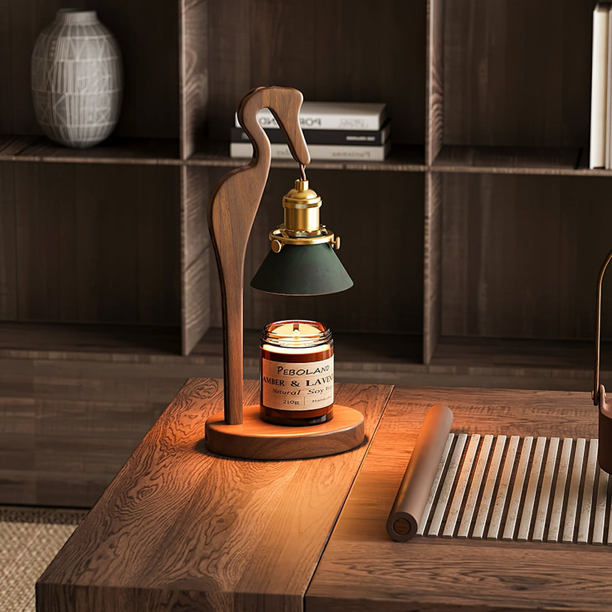 Heron lamp lit on a shelf unit beside a woven mat and a vase
