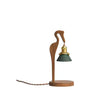 Walnut heron candle warmer lamp on a plain ground with its twisted cord