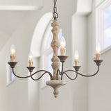 The five lit candle arms seen against a pale wall and an arched window frame