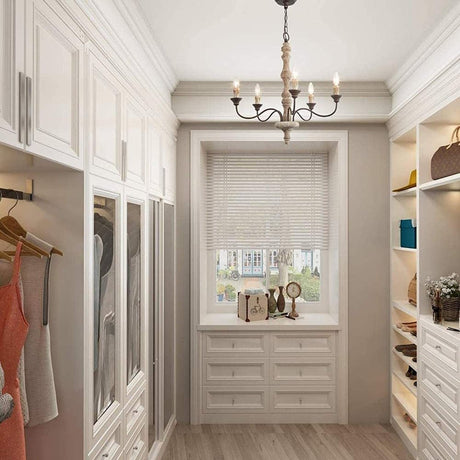 Hung in a dressing room lined with open shelves and drawers in front of a shuttered window