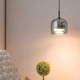 Smoke gray shade hung above a pale bed