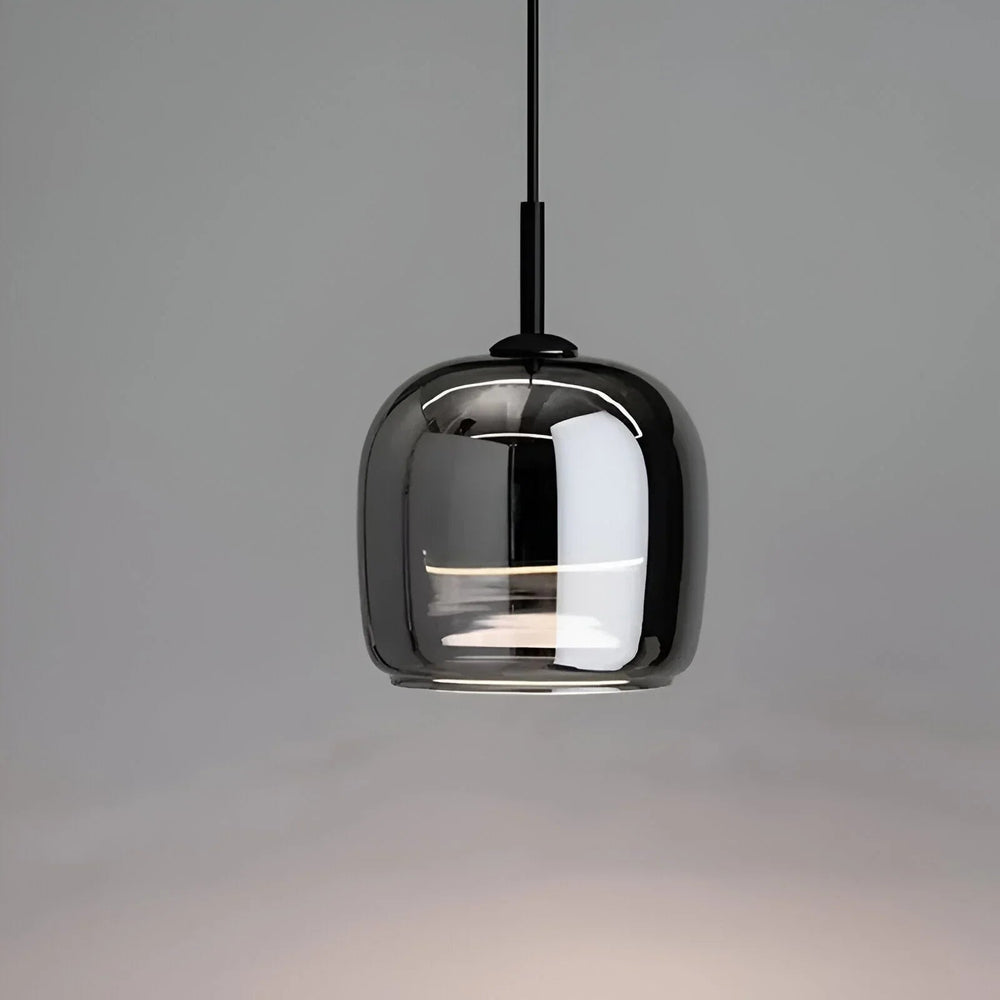Ceiling light with a smoke gray glass shade on a pale wall