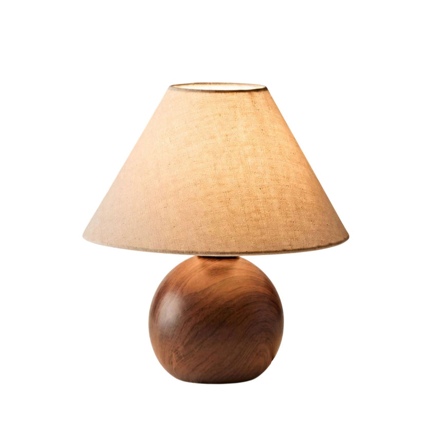 Ceramic bedside lamp seen from the front against a white ground