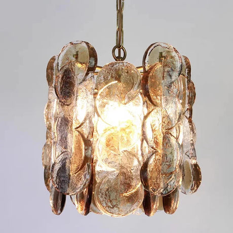 Close view of the overlapping amber glass petals on their metal frame