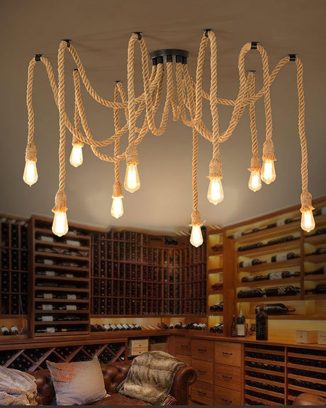 Lit warm above a sofa in a room lined with wine shelving