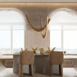 The pale arcs lit over a long dining table with chairs, under window blinds