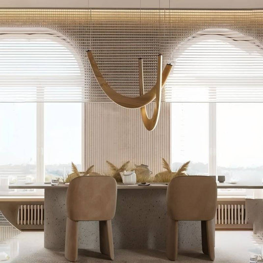 The pale arcs lit over a long dining table with chairs, under window blinds