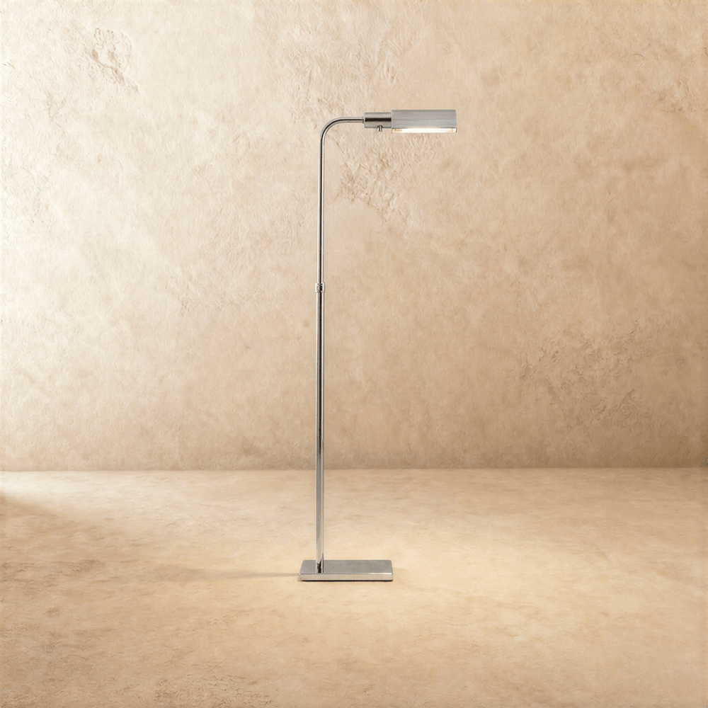 A slim polished chrome stem with a flat rectangular head tipped forward over a small base