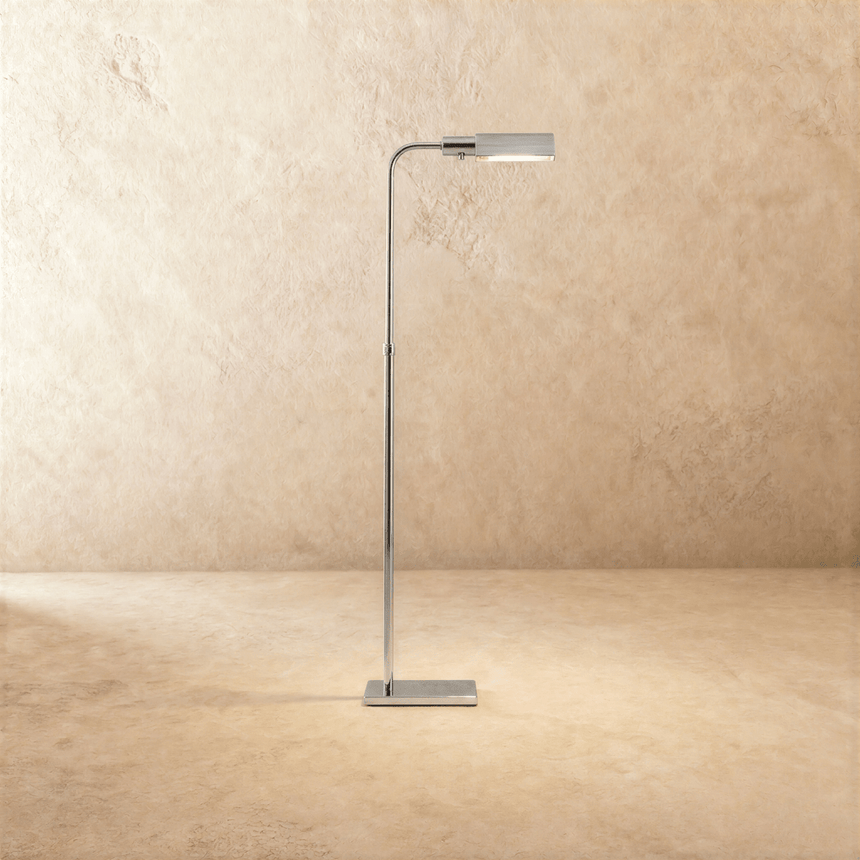 A slim polished chrome stem with a flat rectangular head tipped forward over a small base