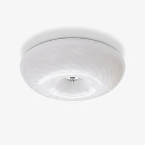 Swirled glass flush mount ceiling light with a chrome center cap