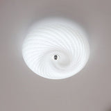 Swirled glass ceiling light seen straight from below showing the spiral pattern