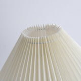 The pleated shade seen from below, the folds running to the edge