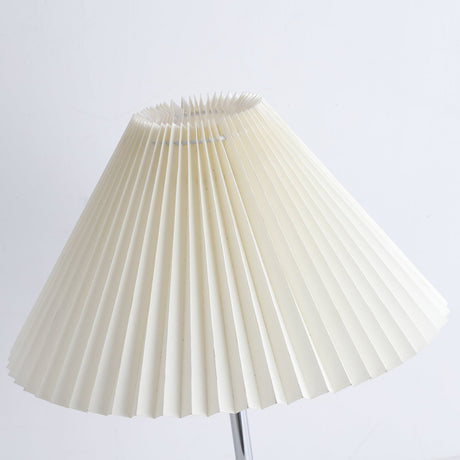 Close view of the pleated cream shade and its folded upper edge