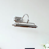The chrome bar seen from above, the arched arm meeting the square wall canopy