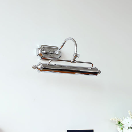 The chrome bar seen from above, the arched arm meeting the square wall canopy