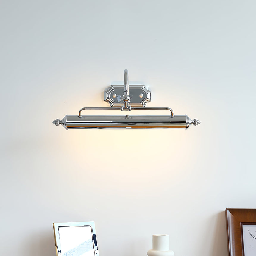 Chrome vanity light, a slim bar with turned ends on an arched arm, lit on a wall