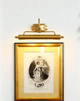 Close view of the gold bar and the turned finial at the end of the shade