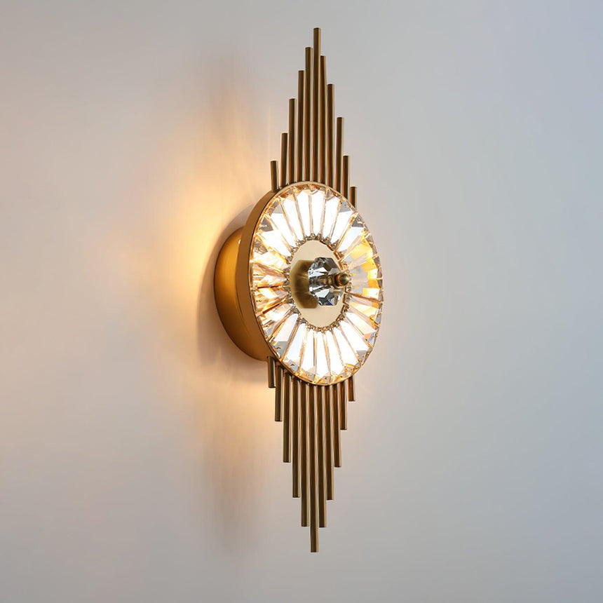 Side view of the lit sconce showing the round wall plate behind the wheel