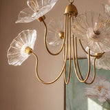 The clear glass poppies lit close, the ribbed petals catching the light