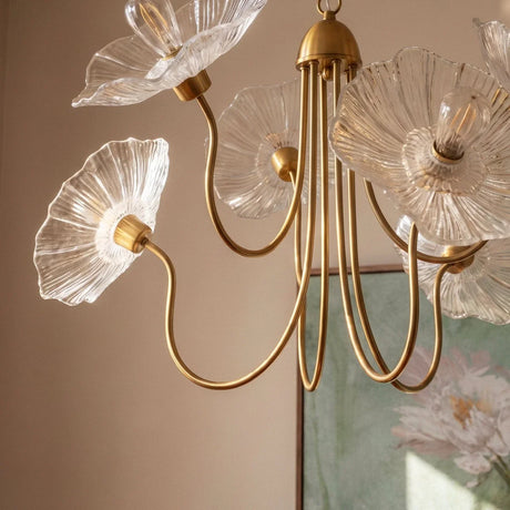 The clear glass poppies lit close, the ribbed petals catching the light