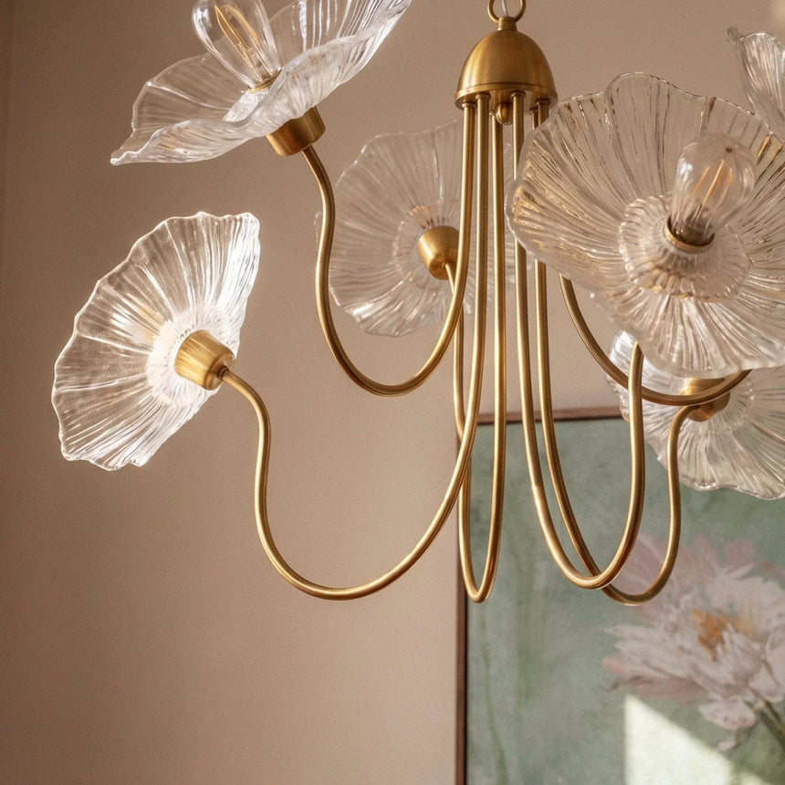 The clear glass poppies lit close, the ribbed petals catching the light