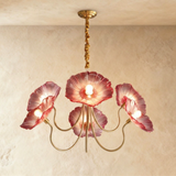 The five arm version with red glass poppies lit above a pale wall