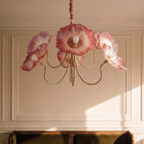 The red poppies lit in a paneled room above a green velvet sofa