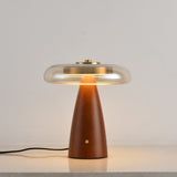 Clear glass table lamp on a straight cone base, plain ground
