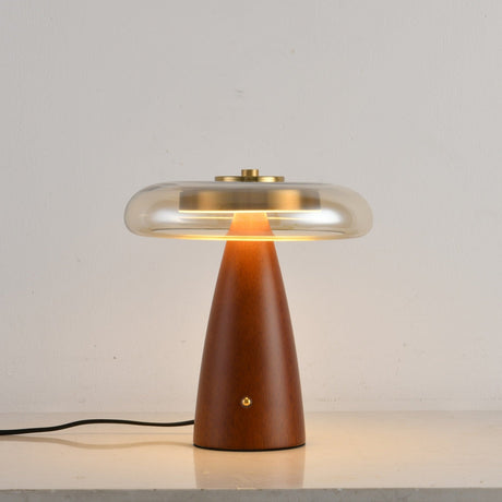 Clear glass table lamp on a straight cone base, plain ground