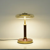 Clear glass disc lamp lit, the light spreading through the glass