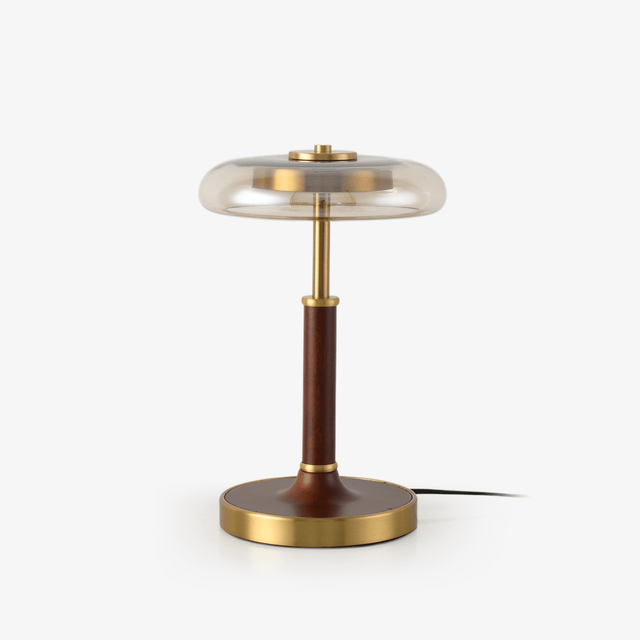 Table lamp with a clear glass disc shade on a walnut column and brass