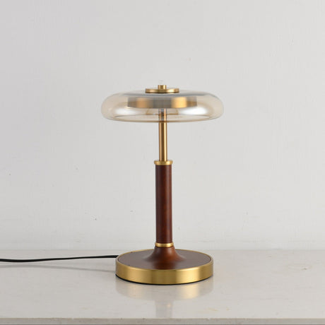 Side view of the glass disc lamp showing the thin walnut column