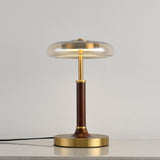Clear glass disc lamp unlit seen from a slight angle