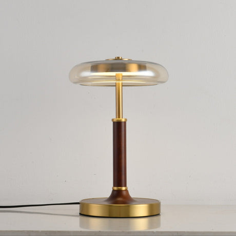 Clear glass disc lamp unlit seen from a slight angle