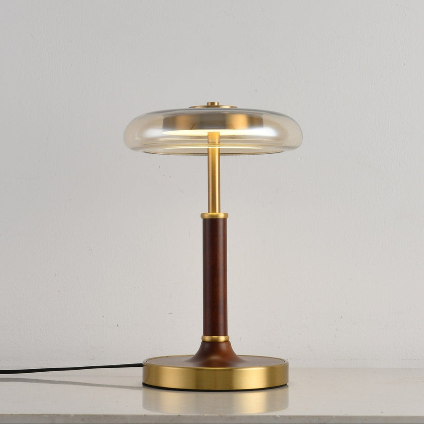 Clear glass disc lamp unlit seen from a slight angle