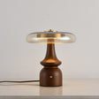 Clear glass table lamp on a stepped spindle base, plain ground