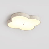 Standard 14.2 in cloud ceiling lamp lit, seen at an angle against a pale wall