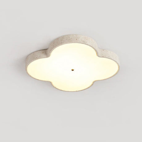 Cloud ceiling lamp lit straight on, the stone rim framing the white glass face