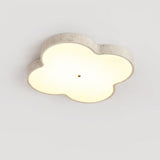 Large 20.9 in cloud ceiling lamp lit, seen at an angle against a pale wall