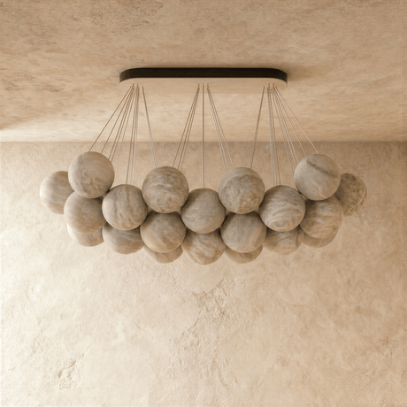 The globes unlit, pale stone spheres hung at two heights from the canopy