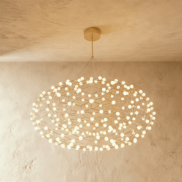 A flattened cloud of gold wire lattice studded with dozens of small white globes