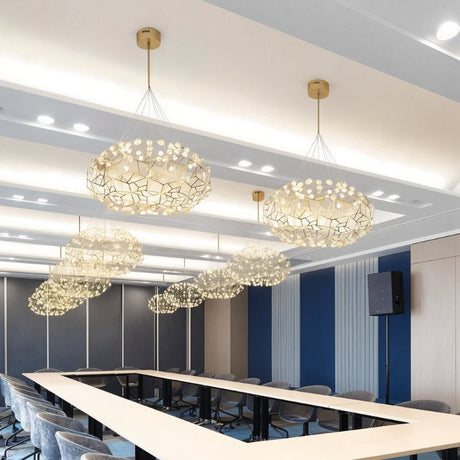 Several of the clouds lit in a row above a long meeting table and its chairs